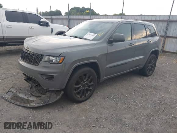 2022 Jeep Grand Cherokee Laredo E with VIN 1C4RJEAG9NC128305, listed as a IAAI auction lot 43037060 with 80,434 mi miles and . Bid and sale history available at DreamBid. Image 18.