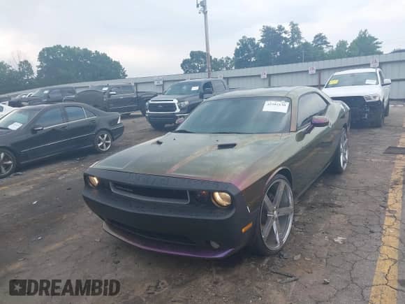 2013 Dodge Challenger SXT with VIN 2C3CDYAG0DH570095, listed as a IAAI auction lot 42282130 with 191,728 mi miles and . Bid and sale history available at DreamBid. Image 2.