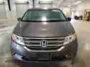 2013 Honda Odyssey Touring z VIN 5FNRL5H94DB035095, wystawiony jako Copart lot #87411385 z przebiegiem 241 495 mil mil oraz Czysty tytuł • Clean title. Historia ofert i sprzedaży dostępna na DreamBid. Obrazek 5.