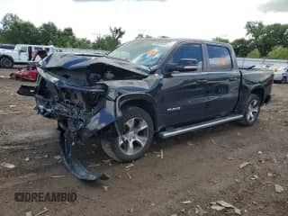 2021 Ram 1500 Laramie with VIN 1C6SRFJTXMN820404, listed as a Copart auction lot 69876845 with Not provided miles and Salvage title. Bid and sale history available at DreamBid. Image 1.