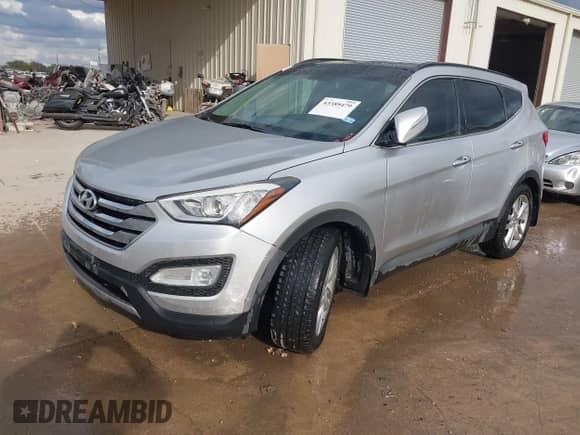 2014 Hyundai Santa Fe with VIN 5XYZW3LA1EG182451, listed as a IAAI auction lot 43389479 with 103,801 mi miles and . Bid and sale history available at DreamBid. Image 2.