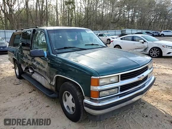 1996 Chevrolet Suburban with VIN 3GNEC16R7TG133368, listed as a Copart auction lot 49671545 with 192,875 mi miles and Salvage title. Bid and sale history available at DreamBid. Image 11.
