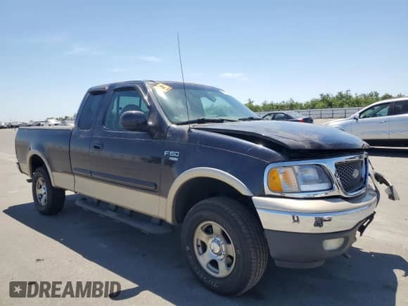 1999 Ford F-150 XL with VIN 1FTRX18L0XKB77329, listed as a Copart auction lot 56355145 with 202,787 mi miles and Salvage title. Bid and sale history available at DreamBid. Image 4.