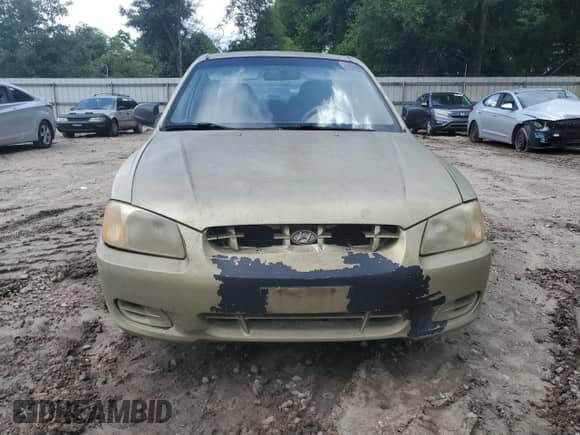 2002 Hyundai Accent GL z VIN KMHCG45C02U296132, wystawiony jako Copart lot #59401835 z przebiegiem 115 421 mil mil oraz Czysty tytuł • Clean title. Historia ofert i sprzedaży dostępna na DreamBid. Obrazek 5.