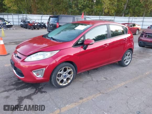2012 Ford Fiesta SES with VIN 3FADP4FJ2CM196390, listed as a IAAI auction lot 43240588 with 142,304 mi miles and . Bid and sale history available at DreamBid. Image 2.