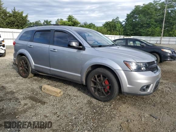 2017 Dodge Journey SXT with VIN 3C4PDDBG0HT703620, listed as a Copart auction lot 69591835 with 100,932 mi miles and Salvage title. Bid and sale history available at DreamBid. Image 4.