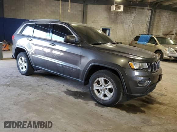 2017 Jeep Grand Cherokee Laredo with VIN 1C4RJEAG0HC746651, listed as a Copart auction lot 70644395 with 143,813 mi miles and Salvage title. Bid and sale history available at DreamBid. Image 4.