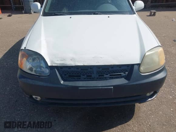 2004 Hyundai Accent GL z VIN KMHCG35C44U295904, wystawiony jako IAAI lot #42702059 z przebiegiem 135 258 mil mil oraz . Historia ofert i sprzedaży dostępna na DreamBid. Obrazek 6.