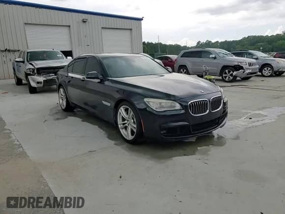 2014 BMW 7 Series 750i xDrive with VIN WBAYB6C53ED224559, listed as a Copart auction lot 58124485 with 114,753 mi miles and Salvage title. Bid and sale history available at DreamBid. Image 13.