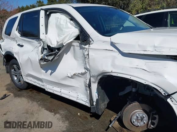 2024 Honda Pilot EX-L with VIN 5FNYG2H57RB001333, listed as a IAAI auction lot 41707956 with 35,865 mi miles and . Bid and sale history available at DreamBid. Image 6.