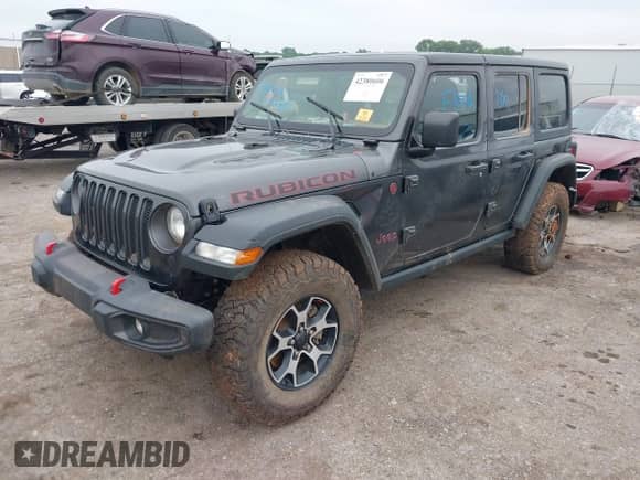 2021 Jeep Wrangler Unlimited Rubicon with VIN 1C4HJXFN0MW780029, listed as a IAAI auction lot 42380606 with Not provided miles and . Bid and sale history available at DreamBid. Image 2.