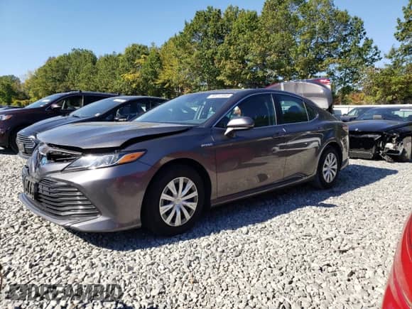 2019 Toyota Camry Hybrid LE z VIN 4T1B31HK9KU512469, wystawiony jako Copart lot #85112345 z przebiegiem 83 416 mil mil oraz Szkoda całkowita • Salvage title. Historia ofert i sprzedaży dostępna na DreamBid. Obrazek 1.