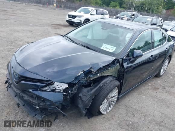 2020 Toyota Camry Hybrid XLE z VIN 4T1F31AK7LU521801, wystawiony jako IAAI lot #42707425 z przebiegiem 66 573 mil mil oraz . Historia ofert i sprzedaży dostępna na DreamBid. Obrazek 2.