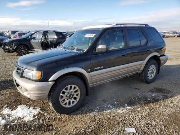 2001 Honda Passport LX with VIN 4S6DM58W014404165, listed as a Copart auction lot 81636614 with 157,744 mi miles and Clean title. Bid and sale history available at DreamBid. Image 1.