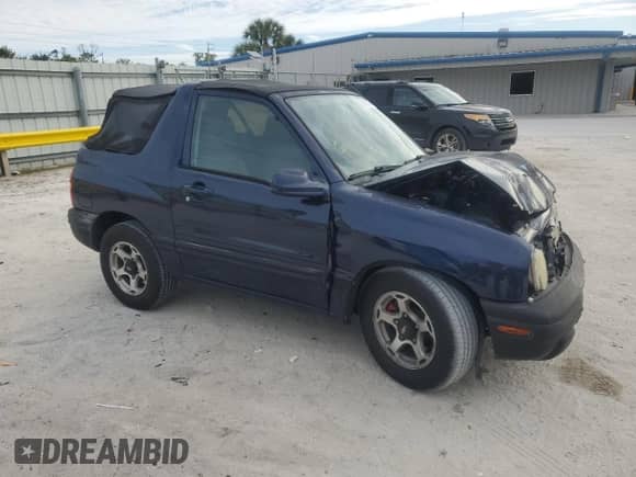 2001 Chevrolet Tracker with VIN 2CNBE18C816911034, listed as a Copart auction lot 88693025 with Not provided miles and Salvage title. Bid and sale history available at DreamBid. Image 4.
