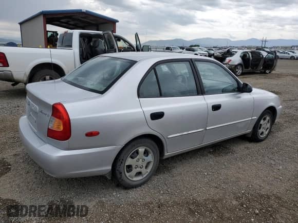 2000 Hyundai Accent with VIN KMHCG45G8YU120795, listed as a Copart auction lot 61005175 with 96,515 mi miles and Clean title. Bid and sale history available at DreamBid. Image 3.