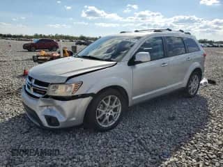 2013 Dodge Journey R/T with VIN 3C4PDDFG7DT657613, listed as a Copart auction lot 86803215 with Not provided miles and Salvage title. Bid and sale history available at DreamBid. Image 1.