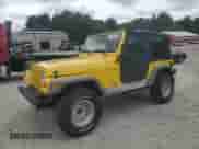 2000 Jeep Wrangler SE with VIN 1J4FA29P0YP775110, listed as a Copart auction lot 71498795 with 72,782 mi miles and Clean title. Bid and sale history available at DreamBid. Image 1.