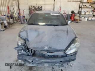 2007 Hyundai Tiburon GT с VIN KMHHN66F47U253212, выставлен на аукционе Copart как лот 85019734 с пробегом 200 172 миль миль и Списание • Salvage title. История ставок и продаж доступна на DreamBid. Изображение 5.