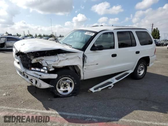 1999 Dodge Durango with VIN 1B4HS28Y1XF573528, listed as a Copart auction lot 71499974 with 118,012 mi miles and Salvage title. Bid and sale history available at DreamBid. Image 1.