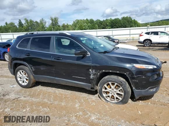 2014 Jeep Cherokee Latitude with VIN 1C4PJMCS5EW127895, listed as a Copart auction lot 66995905 with 125,293 mi miles and Salvage title. Bid and sale history available at DreamBid. Image 4.