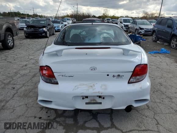 2000 Hyundai Tiburon с VIN KMHJG35F9YU191917, выставлен на аукционе Copart как лот 79629394 с пробегом 179 948 миль миль и Списание • Salvage title. История ставок и продаж доступна на DreamBid. Изображение 6.