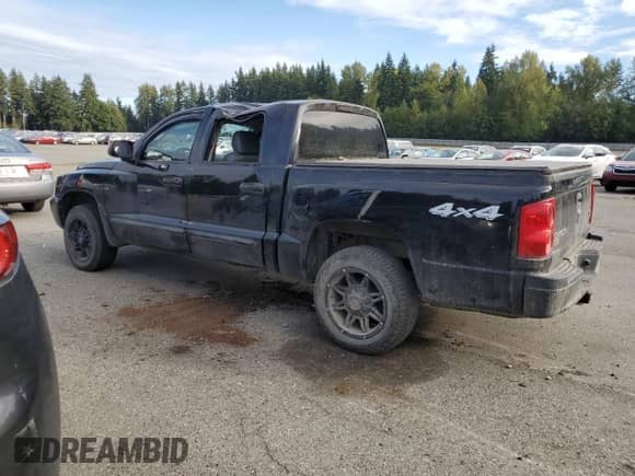 2005 Dodge Dakota Laramie z VIN 1D7HW58N35S193146, wystawiony jako Copart lot #83964685 z przebiegiem 159 839 mil mil oraz Szkoda całkowita • Salvage title. Historia ofert i sprzedaży dostępna na DreamBid. Obrazek 2.