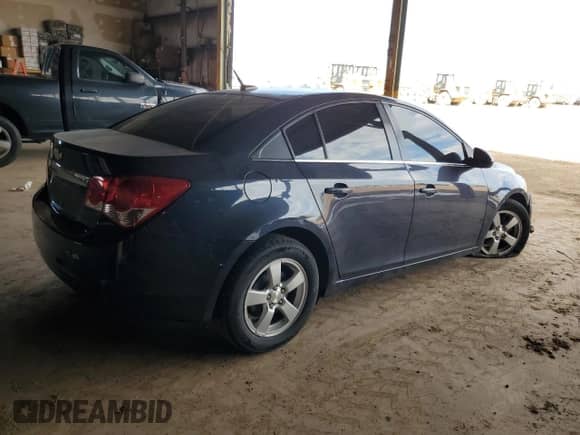 2014 Chevrolet Cruze 1LT z VIN 1G1PC5SB0E7396052, wystawiony jako Copart lot #82611565 z przebiegiem Nie podano mil oraz Szkoda całkowita • Salvage title. Historia ofert i sprzedaży dostępna na DreamBid. Obrazek 3.