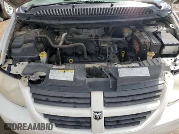 2007 Dodge Caravan SXT with VIN 1D4GP45R57B161051, listed as a Copart auction lot 58259765 with 105,658 mi miles and Salvage title. Bid and sale history available at DreamBid. Image 12.