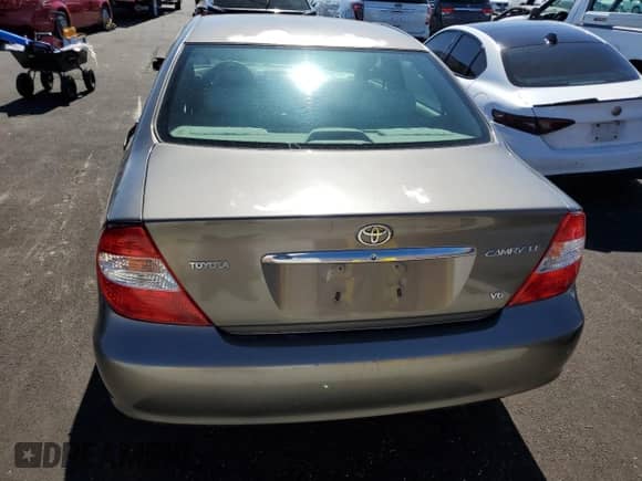 2003 Toyota Camry LE с VIN 4T1BF32K93U562415, выставлен на аукционе Copart как лот 81987345 с пробегом 171 115 миль миль и Списание • Salvage title. История ставок и продаж доступна на DreamBid. Изображение 6.