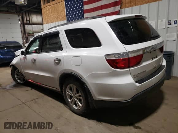 2013 Dodge Durango Crew with VIN 1C4RDJDG9DC554196, listed as a Copart auction lot 80313895 with 104,486 mi miles and Salvage title. Bid and sale history available at DreamBid. Image 2.
