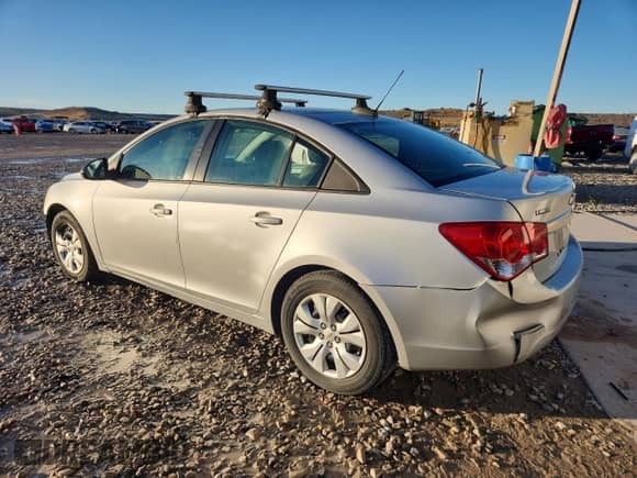 2015 Chevrolet Cruze LS with VIN 1G1PA5SH6F7191119, listed as a Copart auction lot 82159865 with 106,516 mi miles and Salvage title. Bid and sale history available at DreamBid. Image 2.