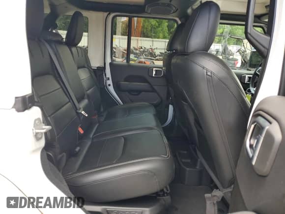 2022 Jeep Wrangler Unlimited Sahara with VIN 1C4JJXP69NW223291, listed as a Copart auction lot 64458055 with 24,574 mi miles and Salvage title. Bid and sale history available at DreamBid. Image 11.