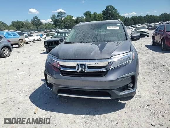 2019 Honda Pilot Touring 8-Passenger with VIN 5FNYF6H99KB033154, listed as a Copart auction lot 70672085 with 104,300 mi miles and Salvage title. Bid and sale history available at DreamBid. Image 14.