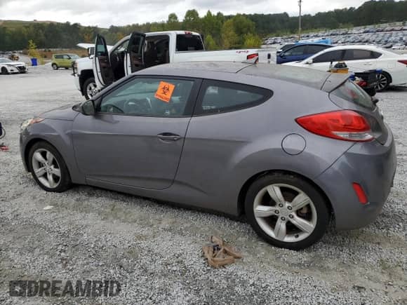 2014 Hyundai Veloster z VIN KMHTC6AD8EU196161, wystawiony jako Copart lot #82244385 z przebiegiem 146 717 mil mil oraz Czysty tytuł • Clean title. Historia ofert i sprzedaży dostępna na DreamBid. Obrazek 2.