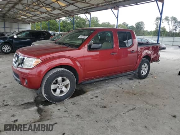 2012 Nissan Frontier SV with VIN 1N6AD0ER5CC467494, listed as a Copart auction lot 70934955 with 106,371 mi miles and Salvage title. Bid and sale history available at DreamBid. Image 1.