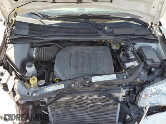 2011 Dodge Grand Caravan Express with VIN 2D4RN4DG6BR700463, listed as a Copart auction lot 69035795 with 74,689 mi miles and Salvage title. Bid and sale history available at DreamBid. Image 12.