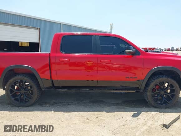 2019 Ram 1500 Rebel z VIN 1C6SRFLT4KN629703, wystawiony jako IAAI lot #42512908 z przebiegiem 135 868 mil mil oraz . Historia ofert i sprzedaży dostępna na DreamBid. Obrazek 13.