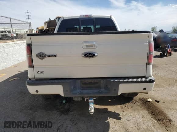 2012 Ford F-150 Lariat with VIN 1FTFW1E68CFB85590, listed as a Copart auction lot 58897445 with 131,901 mi miles and Salvage title. Bid and sale history available at DreamBid. Image 6.