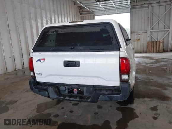 2018 Toyota Tacoma SR with VIN 5TFRX5GN9JX122396, listed as a IAAI auction lot 42933585 with 107,492 mi miles and . Bid and sale history available at DreamBid. Image 16.