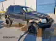 2004 Jeep Grand Cherokee Laredo with VIN 1J4GW48S84C414930, listed as a Copart auction lot 85699065 with 168,359 mi miles and Salvage title. Bid and sale history available at DreamBid. Image 4.