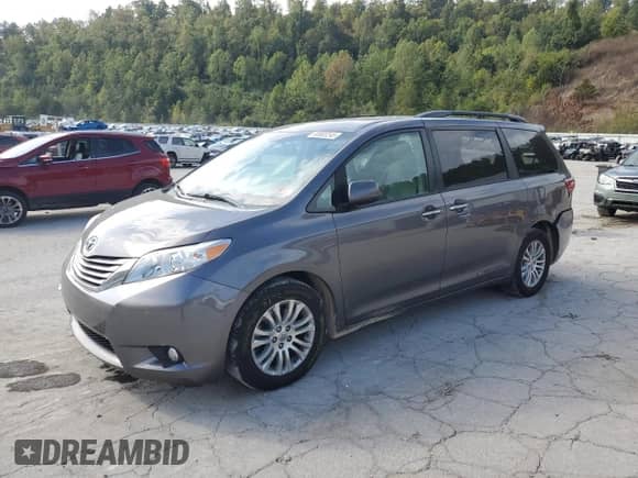 2015 Toyota Sienna XLE with VIN 5TDYK3DC7FS567248, listed as a Copart auction lot 80903245 with 143,175 mi miles and Salvage title. Bid and sale history available at DreamBid. Image 1.