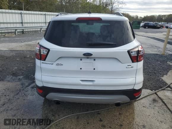 2018 Ford Escape SE z VIN 1FMCU9GDXJUC76982, wystawiony jako Copart lot #87299125 z przebiegiem 88 151 mil mil oraz Czysty tytuł • Clean title. Historia ofert i sprzedaży dostępna na DreamBid. Obrazek 6.
