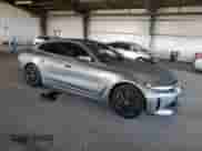 2024 BMW i4 eDrive35 with VIN WBY43AW05RFS37971, listed as a Copart auction lot 70945365 with 40,946 mi miles and Salvage title. Bid and sale history available at DreamBid. Image 4.