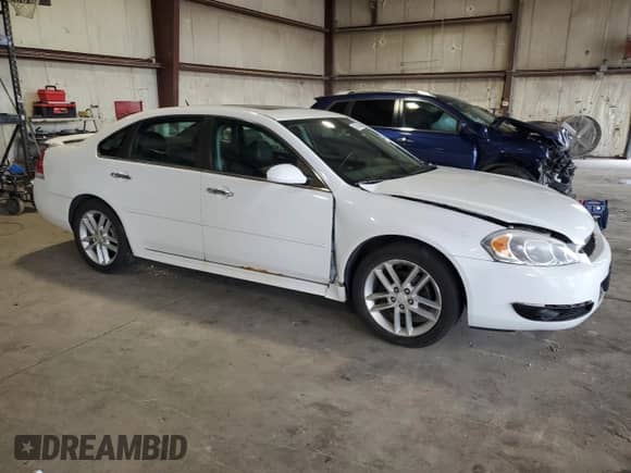 2012 Chevrolet Impala LTZ with VIN 2G1WC5E30C1221083, listed as a Copart auction lot 81643965 with 153,674 mi miles and Salvage title. Bid and sale history available at DreamBid. Image 4.