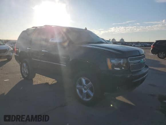 2011 Chevrolet Tahoe LTZ z VIN 1GNSCCE0XBR167532, wystawiony jako Copart lot #68463375 z przebiegiem Nie podano mil oraz Szkoda całkowita • Salvage title. Historia ofert i sprzedaży dostępna na DreamBid. Obrazek 4.