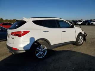 2015 Hyundai Santa Fe z VIN 5XYZWDLA2FG293470, wystawiony jako Copart lot #87119555 z przebiegiem 168 704 mil mil oraz Szkoda całkowita • Salvage title. Historia ofert i sprzedaży dostępna na DreamBid. Obrazek 3.
