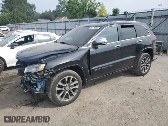 2017 Jeep Grand Cherokee Overland with VIN 1C4RJFCG4HC624457, listed as a Copart auction lot 60759955 with 130,595 mi miles and Salvage title. Bid and sale history available at DreamBid. Image 1.
