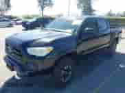 2018 Toyota Tacoma SR with VIN 3TMCZ5AN2JM127244, listed as a IAAI auction lot 41698199 with 61,535 mi miles and . Bid and sale history available at DreamBid. Image 2.