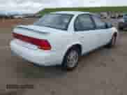 1999 Saturn SL z VIN 1G8ZK5279XZ290439, wystawiony jako IAAI lot #41899736 z przebiegiem 154 348 mil mil oraz . Historia ofert i sprzedaży dostępna na DreamBid. Obrazek 4.